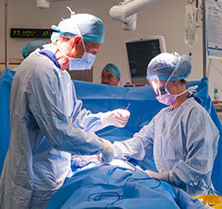 Surgery being performed in an operating theatre at St Georges Hospital London Zonal hospital